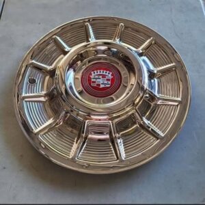 Four 57 cadillac hubcaps Recently re-polished .Brand new cadillac emblems.